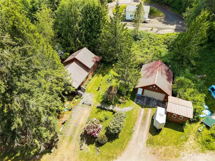 Aerial view of Home on left, Garage and storage shed on right Aerial view of Home on left, Garage and storage shed on right