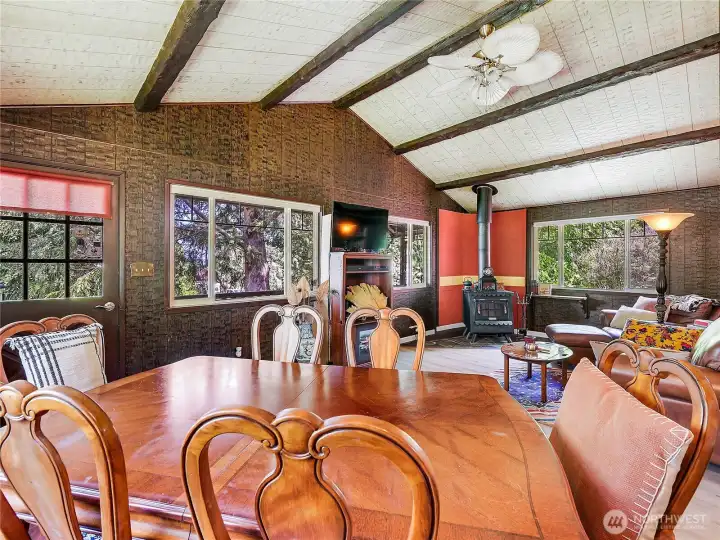 Specialty wood walls in living room. Wood Beams and vaulted ceiling, create a cozy atmosphere. Specialty wood walls in living room. Wood Beams and vaulted ceiling, create a cozy atmosphere.