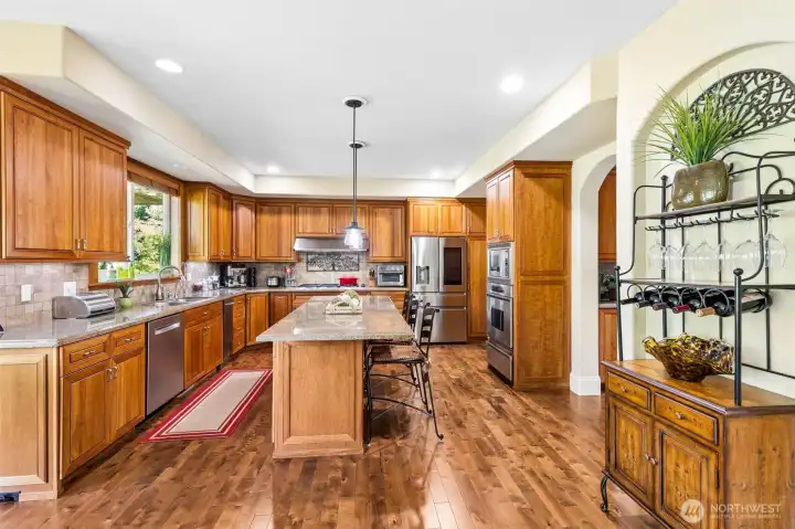 Gourmet kitchen with large island, butler's pantry, & breakfast nook.