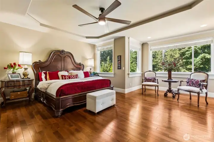 Luxurious Primary Suite Walks Out to the Deck, with 5-piece En-suite, Jetted Tub, Walk-in Closet.