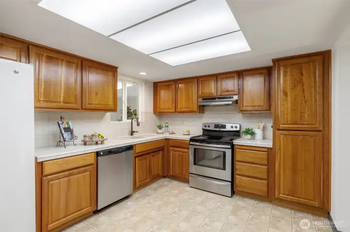 Functional kitchen with plenty of workspace and storage. Enjoy preparing meals while staying connected to the adjacent living spaces.