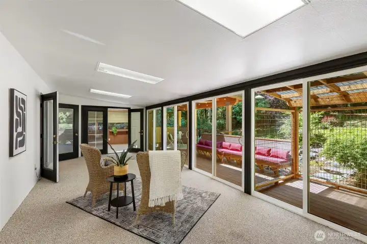Light filled sunroom offers the perfect place for morning coffee or afternoon relaxation.