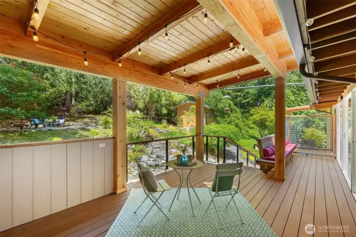 Newly constructed covered back deck was thoughtfully designed for year-round entertaining and outdoor living.