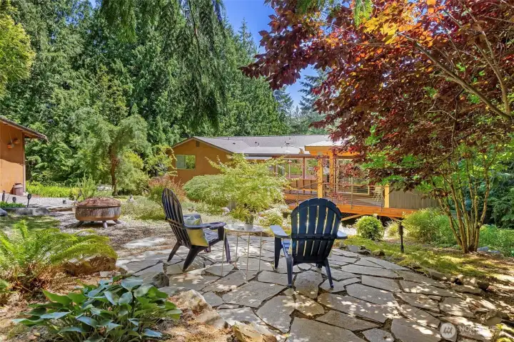 Beautiful mature landscaping surrounds the home and enhances its private setting.