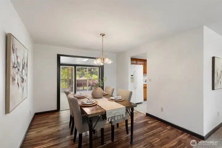 Dining area conveniently connects the kitchen and sunroom, creating an ideal flow for everyday living and entertaining.