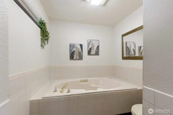 Relax and unwind in the private primary bathroom.