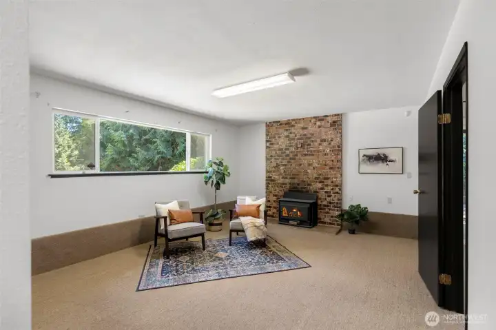 Downstairs family room offers flexible living space for movie nights or entertaining.