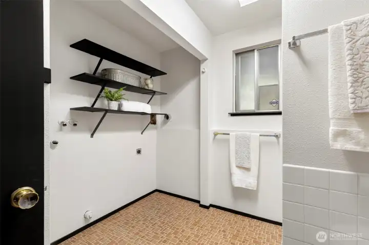 Laundry room offers extra storage and everyday convenience.