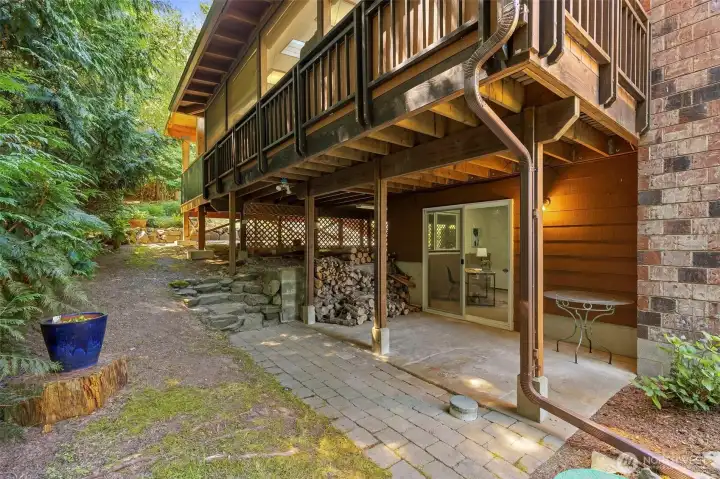 Dedicated lower-level entrance with its own private patio offers flexibility for guests, multigenerational living, or a home office.