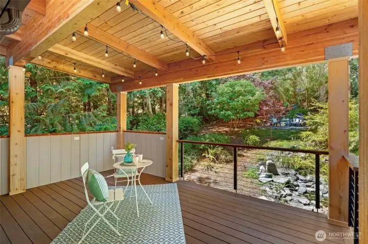 New covered back deck creates an inviting space for outdoor dining and year round enjoyment.