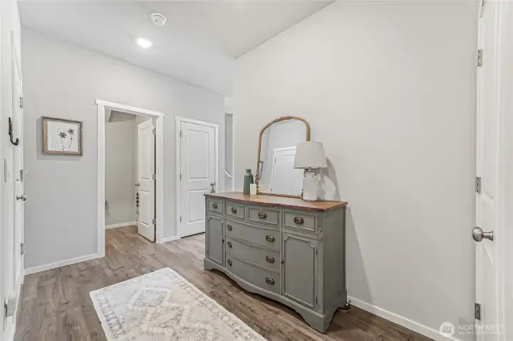 Large entry hall. Guest bath and walk-in pantry are at the end of the hall.