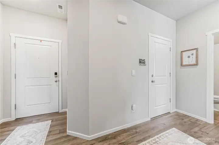 Looking back towards the front door on the left and garage access is through the door on the right.