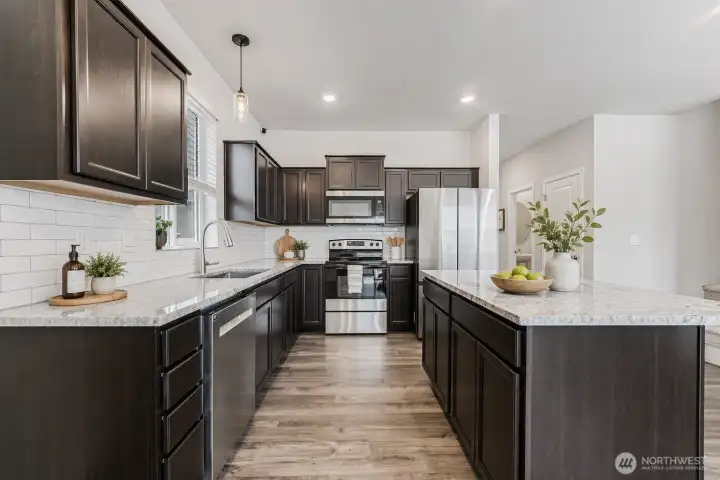 Stainless steel appliances are featured.
