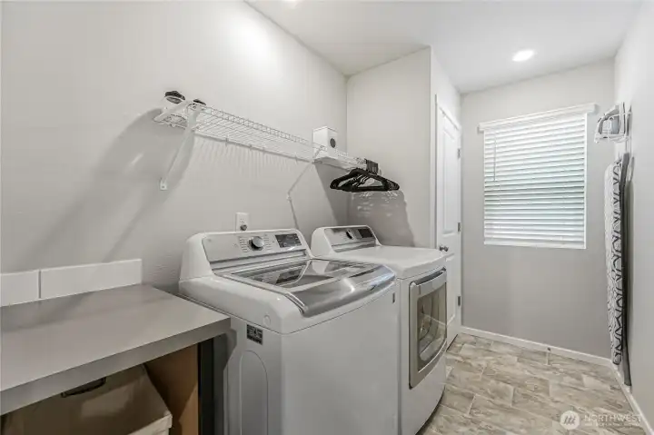 Convenient upstairs laundry room.