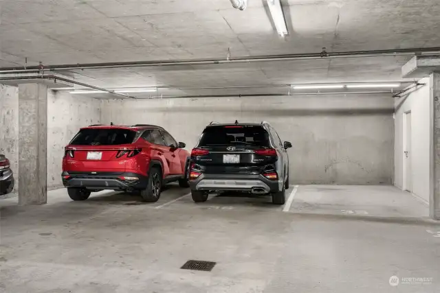 Three generous parking spaces with giant storage space adjacent to to parking spots.  Door to storage space is on the right.