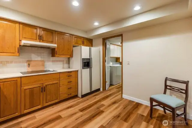 The kitchen can be accessed from the garage through the large utility room.