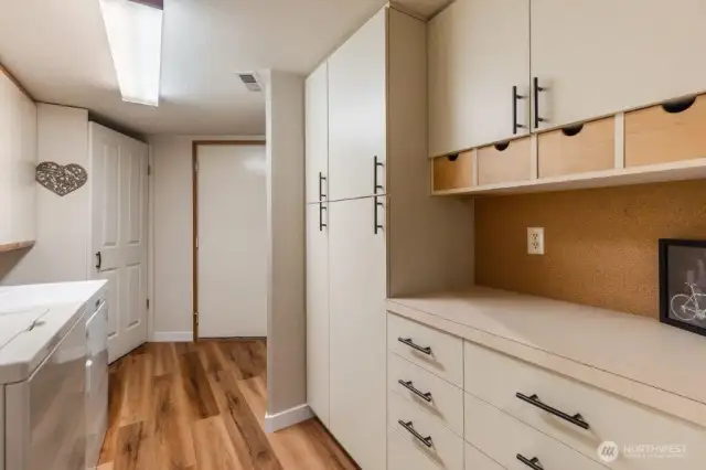 Looking through the pantry to the garage door. The door on the left is a pantry. So much storage and counterspace here!