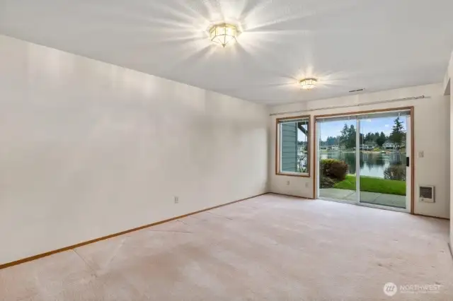 The downstairs family room with slider to the lake level patio.