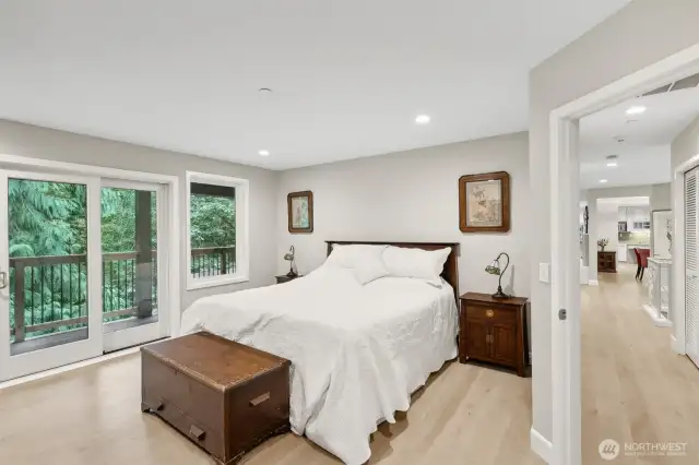 The primary bedroom is on the main level and features direct access to the balcony. The other bedroom on this floor is right across the hall.
