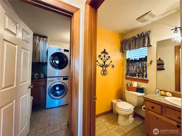 Peek at the laundry room and half bath on main