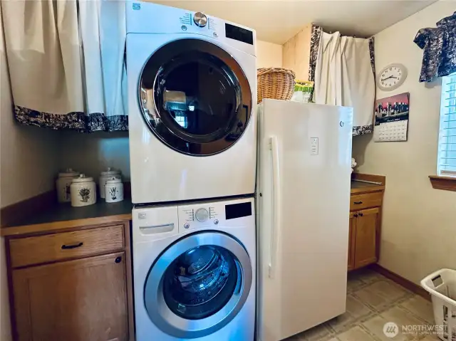 Laundry room with a window to side yard
