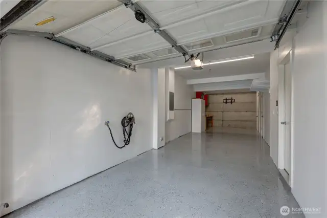 Large garage recently refinished w/ epoxy floors.