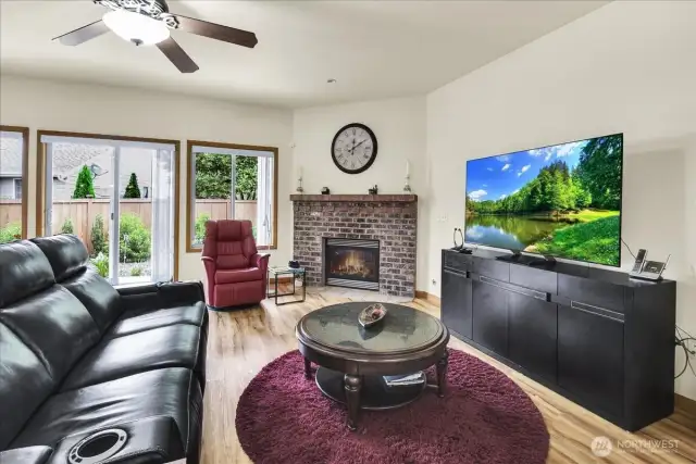 Living Room with Gas Fireplace and slider to fully fenced in back yard and covered patio