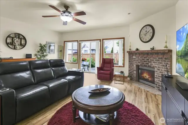 Living Room with Gas Fireplace and slider to fully fenced in back yard and covered patio