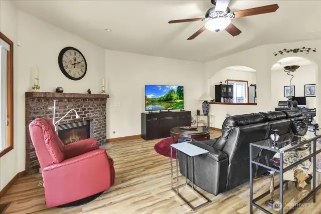 Living Room with Gas Fireplace and slider to fully fenced in back yard and covered patio