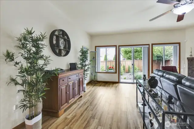 Living Room with Gas Fireplace and slider to fully fenced in back yard and covered patio
