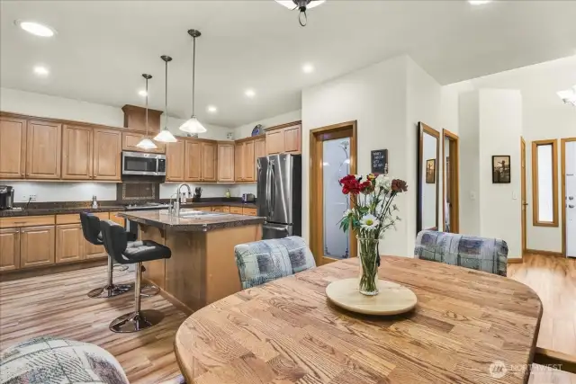 Breakfast Nook at kitchen that boasts New Stainless Steel Appliances, walk in pantry, abundant cabinet storage, tons of counter space, and Large Island with room for bar stools.