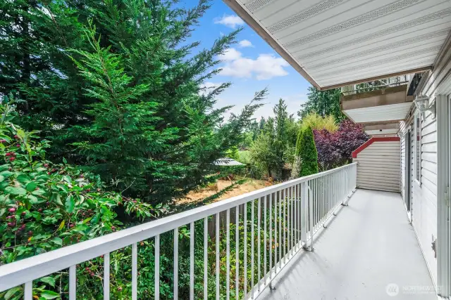 Huge private Deck with 2 Sliders that runs from the Living Room to the Guest Bedroom.
