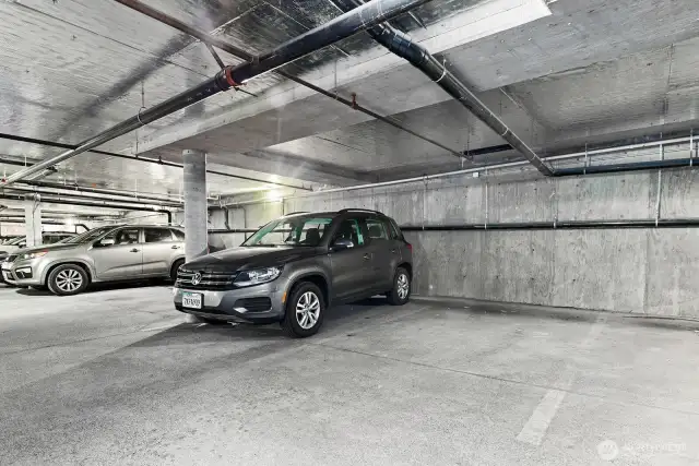 Garage parking space (empty space pictured) is included and no cement poles to navigate on either side!
