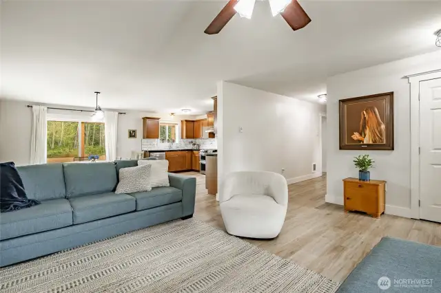 Another view of living room. Many recent updates include new laminated wood flooring and painted walls & trim.