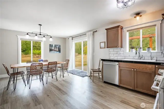 Spacious kitchen and dining room that opens to a lighted large patio with hot tub.