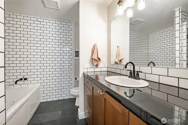 Primary bathroom with jetted tub and walk in shower.