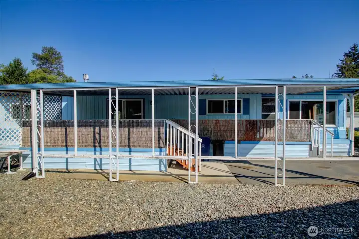 Covered porch and parking area.