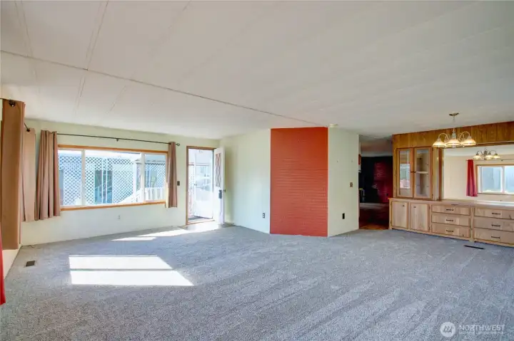 Enter into the home to a large living/dining area. Large built-in in the dining area.