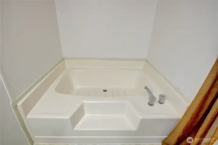 Step in soaking tub.