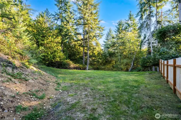 Lower level of property - fenced neighbor on right