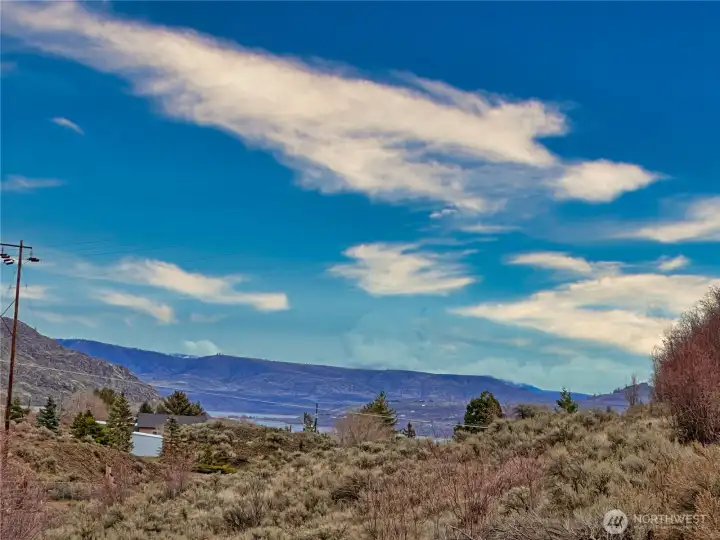Lake Roosevelt can be seen in the distance from bottom tier running along Pleasant Valley Rd where an easy in RV/camper trailer parking area is located