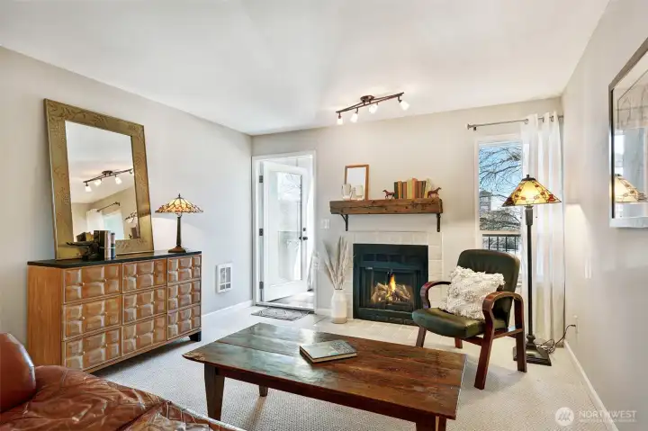 The living room is very spacious and is anchored by a wood fireplace and a beautiful mantel.