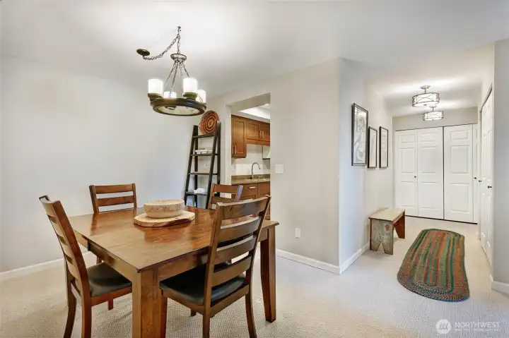 In the hallway, one closet is for hanging winter coats and organizing shoes.  The other closet is the full size washer and dryer as well as the water heater.