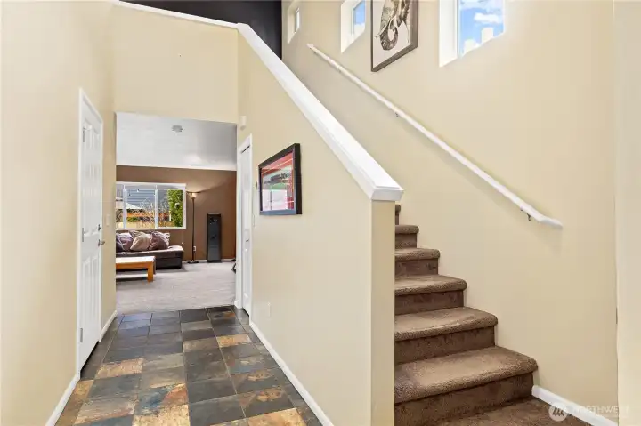 Welcoming entry with tile flooring and sightlines into the open main living space.