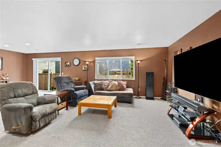 Large windows bring in natural light and enhance the open, airy feel throughout the home.