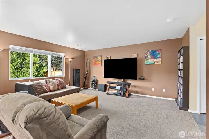 Bright living room with open layout, neutral tones, and natural light—ideal for relaxing or entertaining.
