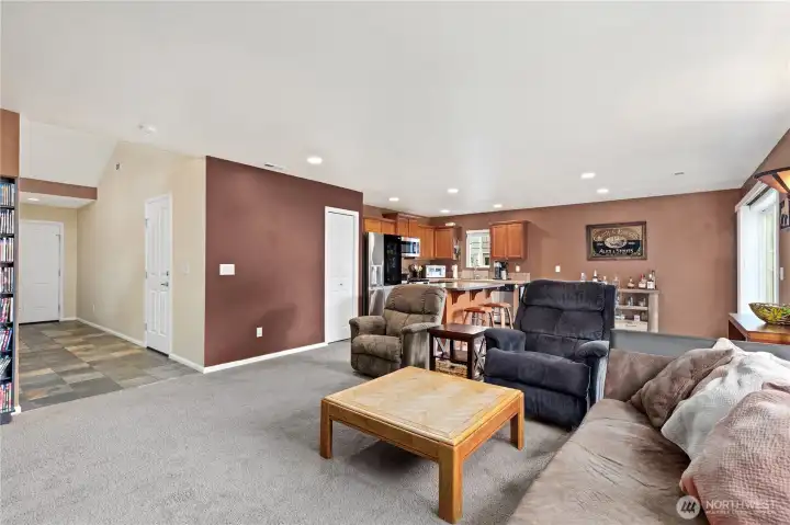 Spacious living area flows easily into dining and kitchen spaces, creating an open-concept feel for everyday living.