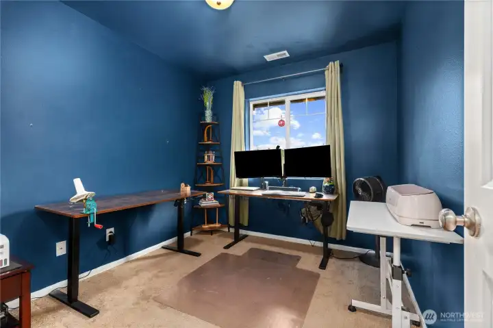 Secondary bedroom offers flexibility for home office, guest room, or hobby space.