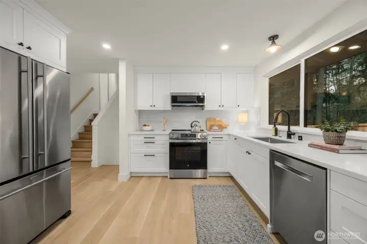 Designer kitchen with quartz countertops.