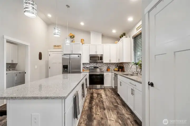 Utility Room through the door to the left. Garage straight ahead.